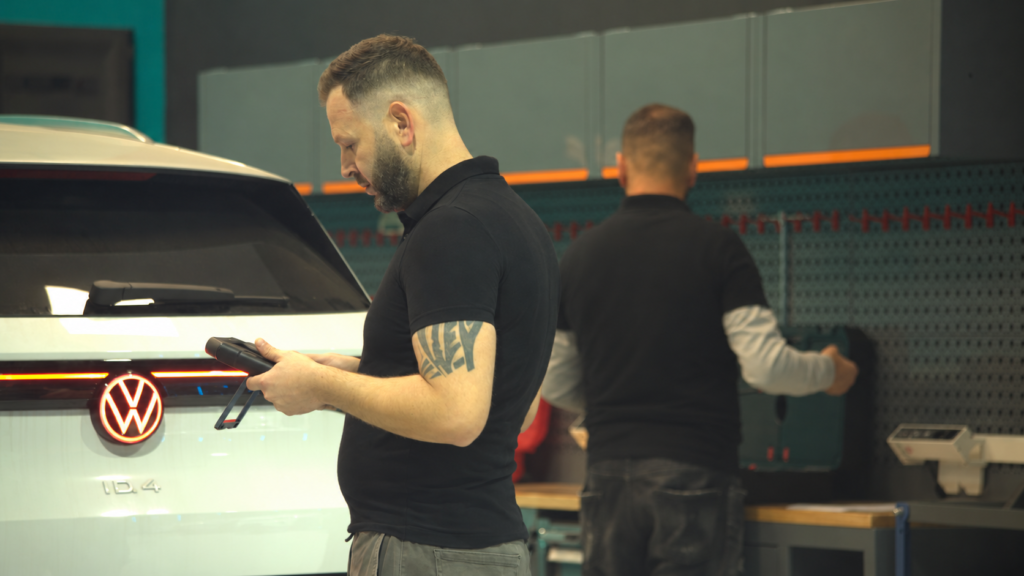 Technicians performing vehicle diagnosis